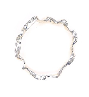 a circular unndulating silver bracelet.