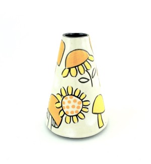 A cone shaped ceramic vase with a white background, hand illustrated yellow and orange mushrooms and yellow sunflowers.