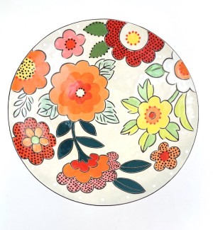 a white ceramic bowl illustrated with white, yellow and orange flowers