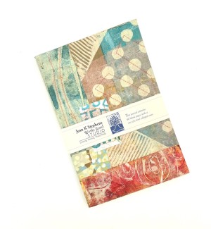 hand collaged and stitched journal with various decorative patterns and colors.