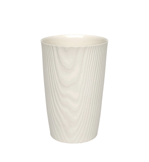 a white porcelain cup with an imprint that resembles wood grain.