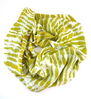 a silk scarf with color striations of cucumber green and white.