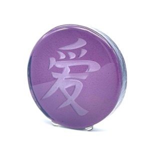 a round purple glass disc with a sandblasted Chinese characture 'Love'.