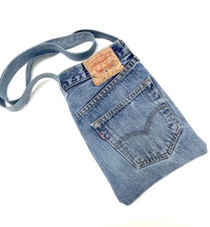 a handsewn blue jean fabric shoulder bag with the original Levis label and rear pocket.
