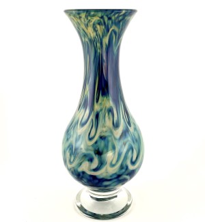 a hand blown teardrop shaped glass vase with a stormy swirl pattern of blues and greys across the surface.
