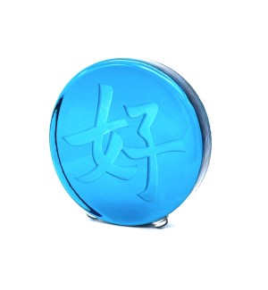 a blue round glass disc with the Chinese character 'Goodness, Benevolence'.  