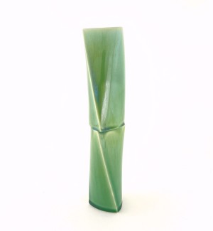 a tall narrow green ceramic vase that resembles two sections of bamboo.