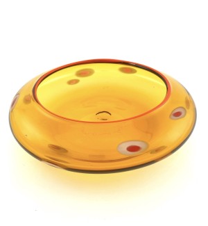 a low glass bowl with a transparent orange body and a bright orange banded lip.