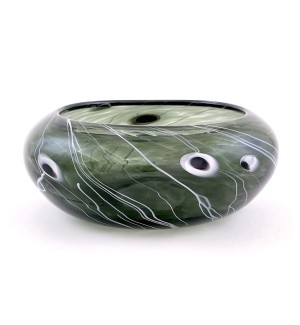 a translucent grey-green glass bowl with thin white lines that resemble star trails in a night sky.