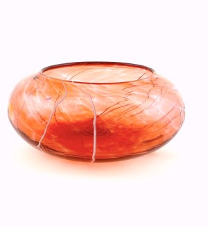 a translucent rosy orange glass bowl with thin white lines. 