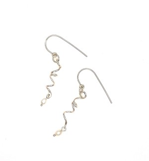 a pair of silver hook style dangle earrings with a twisty form and a white pearl dangle.