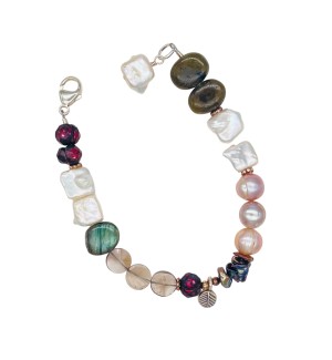 a bracelet of strung beads in varied shape and color from white pearls to faceted dark beads.
