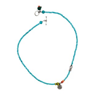 a strung bead necklace of turquoise beads and small silver beads with a toggle clasp.