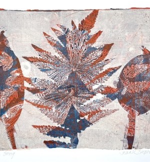 a print from natural plant leaves overlapping in navy, rust and white inks.