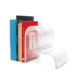 a 3D printed glass bookend in the shape of a wave holding up four books.