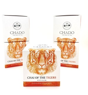 three square white boxes with an illustration of a tiger head and the words 'Chai of the Tiger' printed. 