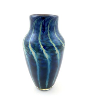 Handblown dark blue glass vase with swirling stripe pattern in cream and pale green. 