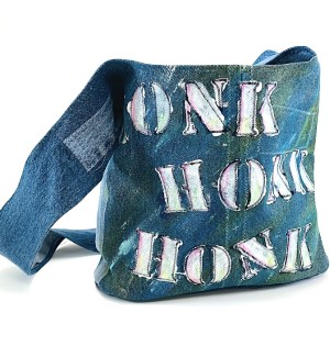 a blue jean fabric shoulder bag with stenciled painted letters, honk, honk, beep, beep.