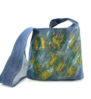 a blue jean fabric shoulder bag with stenciled painted letters, yes, no, maybe.
