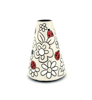 a cone shaped ceramic bud vase with a white background and an illustration of red lady bugs and white flowers.