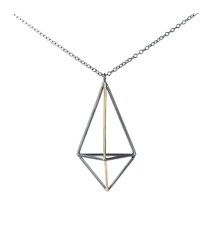 a Sterling silver and gold pendant in the shape of a dimensional elongated pyramid.