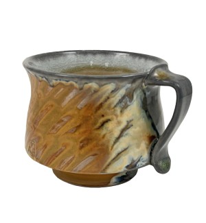 a short mug with orange and dark grey details