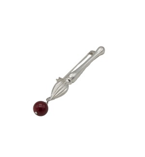 beautiful brooch that balances sculptural silverwork with a vibrant color accent