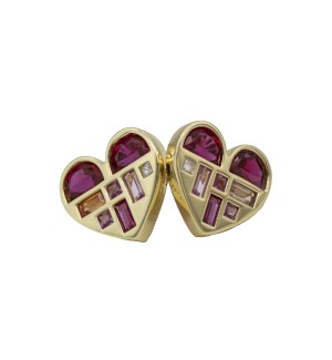 A graphic heart silhouette filled with mixed-cut gemstones arranged in a structured, painterly layout.