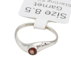 a sterling silver mini twist ring with a garnet gemstone