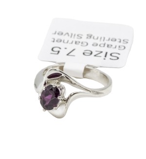 a sterling silver ring with a grape garnet gemstone