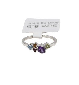 a sterling silver cluster ring with a variety of colored gemstones