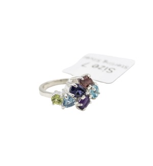 a sterling silver cluster ring with a variety of colored gemstones