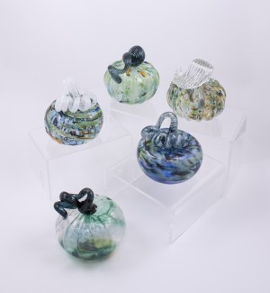 a variety of swirled blues, and greens, with some pops of orange and brown