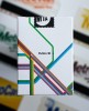 the back of a pack of playing cards with 'Fulton Street' and a multi color stripe deesign.