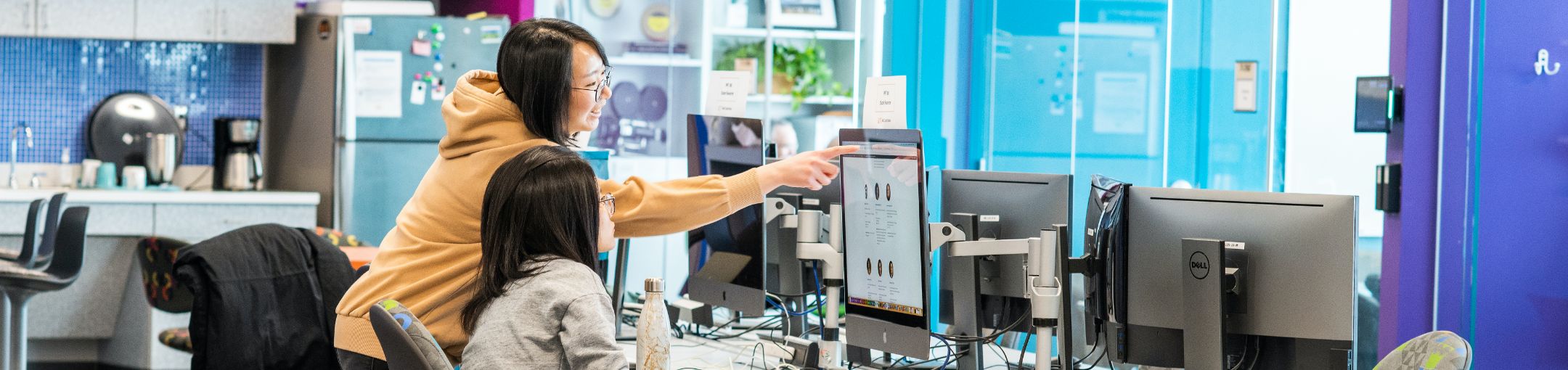 two people working in a computer lab