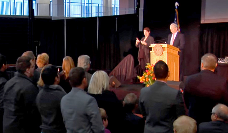 People applauding at the announcement of Dr. Munson as RIT president.