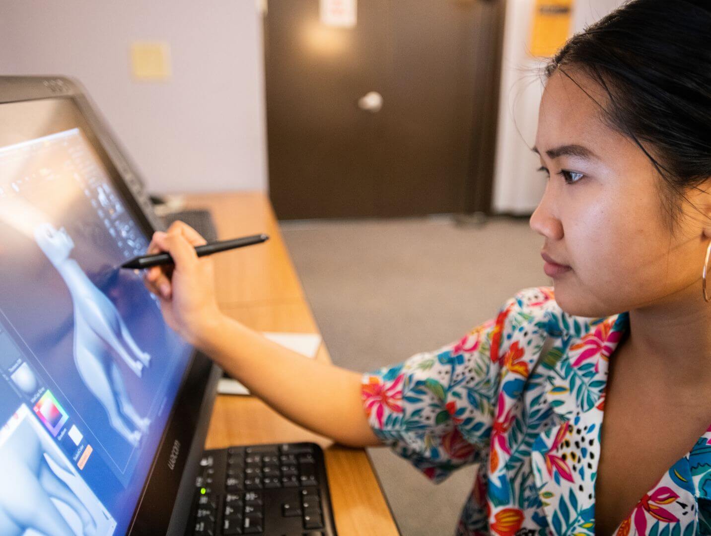 An R I T student working on a 3d model in an editing program for film or animation.