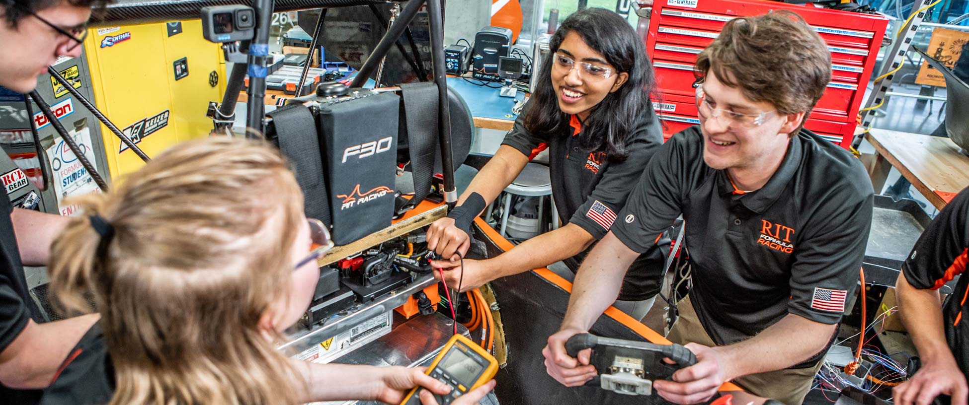 A group of student engineers work on a project.