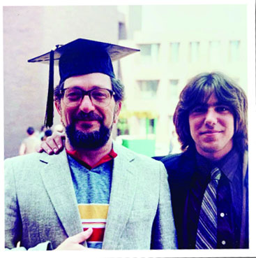 Adam with his dad at graduation