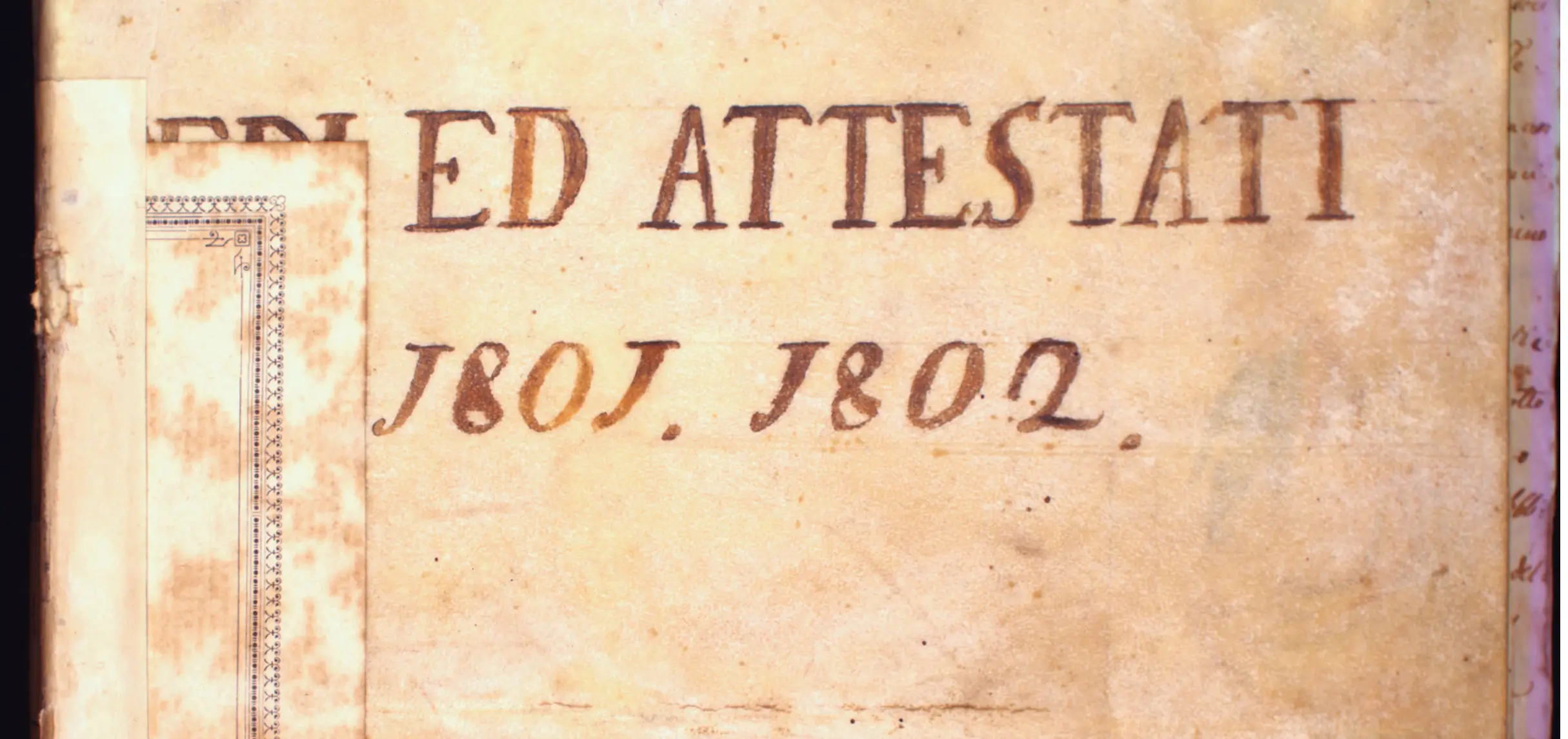 A piece of binding showing traces of lettering.