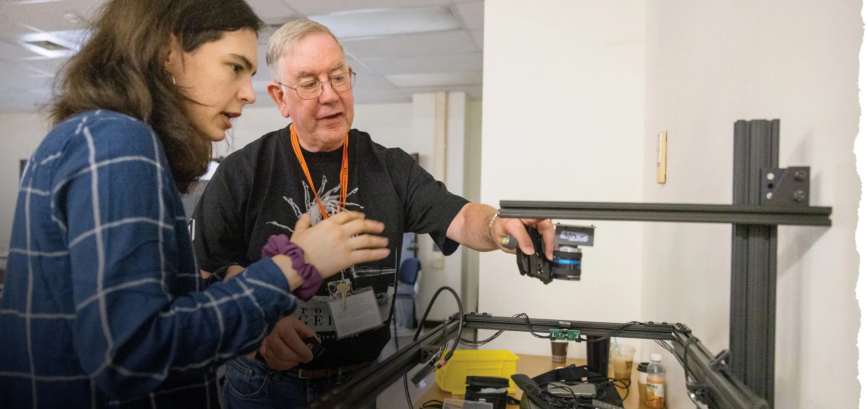 Lilli Kelley, left, explains the MISHA 3D system to Professor of Practice Tom Rieger, right.