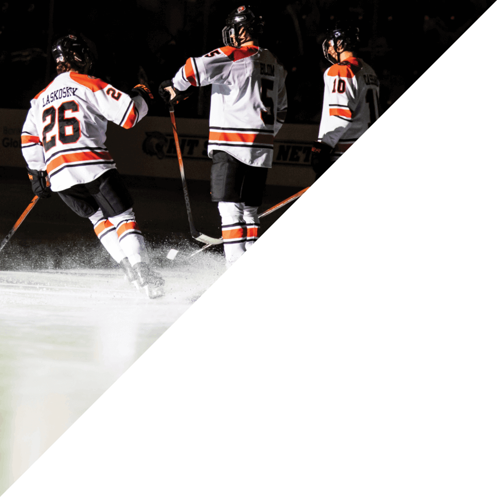 Hockey players standing on ice in their uniforms