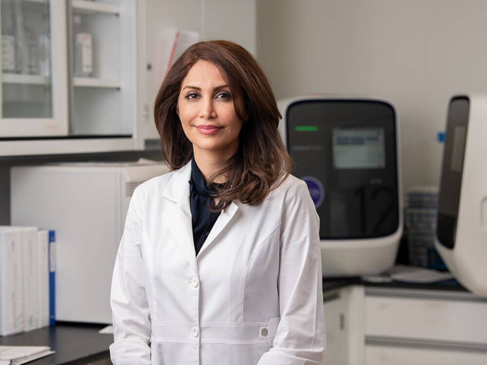Sherry Dadgar in a lab coat.