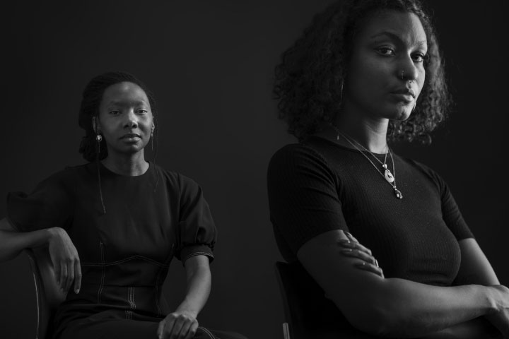 a black and white photo of two women