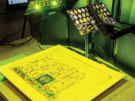 Old text being looked at under a special yellow light.