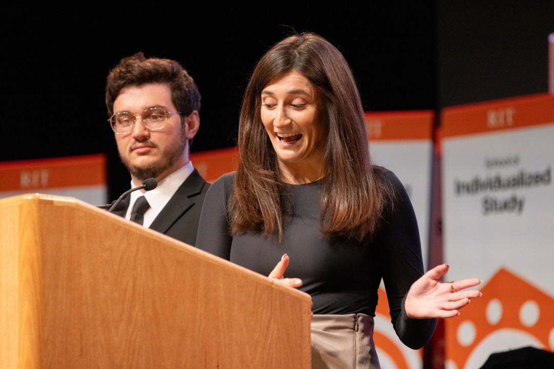 President Sanders's daughter and son address the audience at the podium during the inauguration.