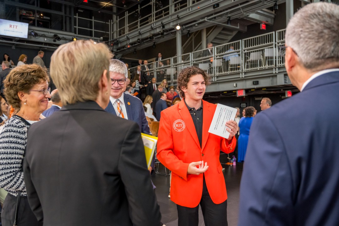 The R I T student government president speaking informally to a group.