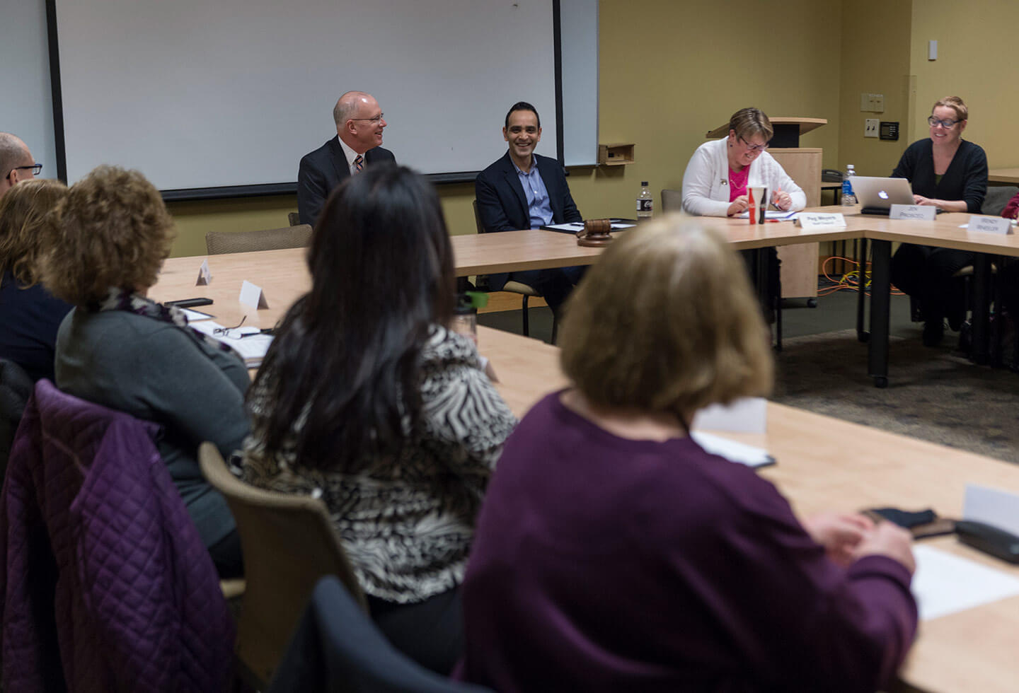 President Munson meeting with staff members
