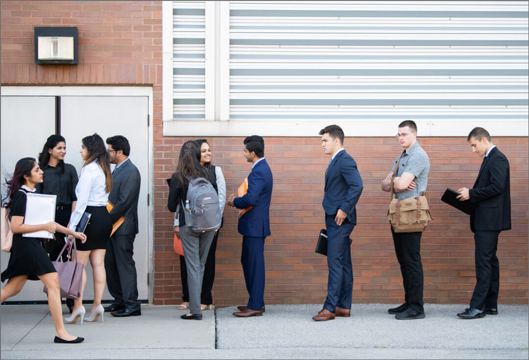 RIT students in business attire standing in line to enter the career fair
