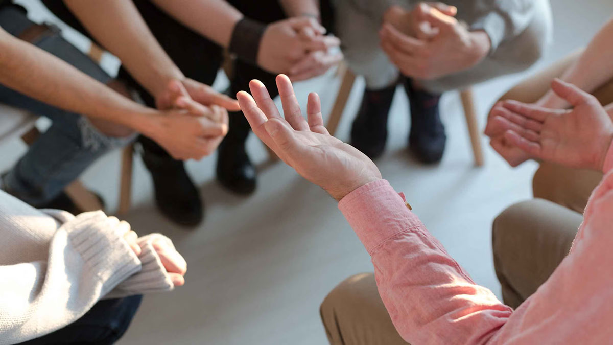 Someone holding their hands opened to help others.